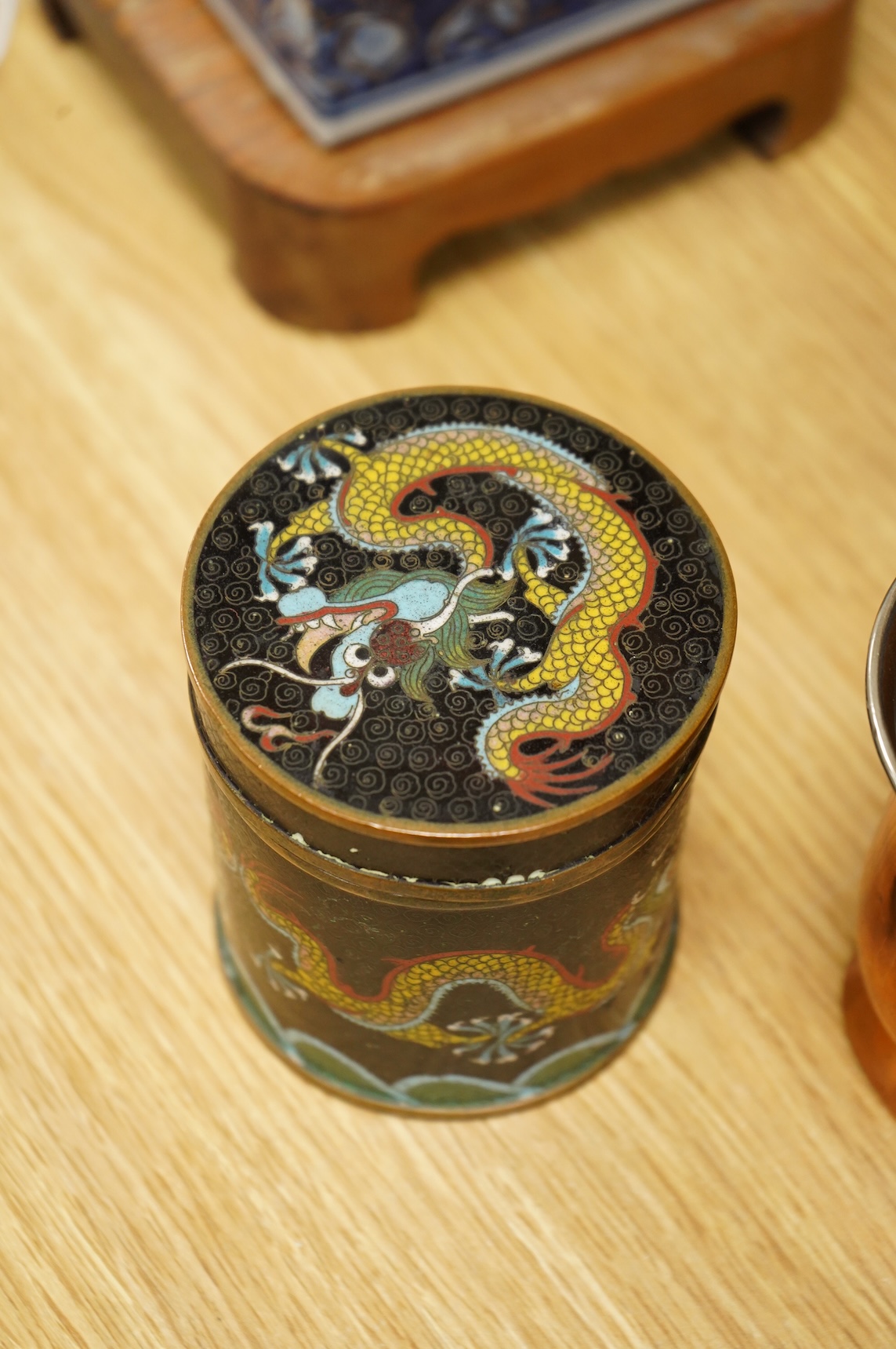 A Chinese cloisonné enamel ‘dragon’ jar and cover, a Chinese miniature four-fold table screen, two metalware tankards and a reproduction Japanese tsuba, cloisonne jar 9cm